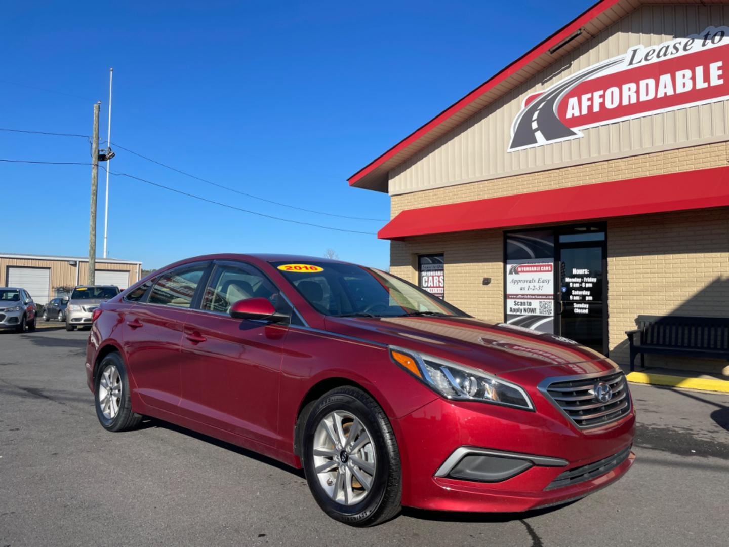 2016 Maroon Hyundai Sonata (5NPE24AF6GH) with an 4-Cyl, 2.4 Liter engine, Auto, 6-Spd w/Shiftronic and Drive Mode Select transmission, located at 8008 Warden Rd, Sherwood, AR, 72120, (501) 801-6100, 34.830078, -92.186684 - Photo#1